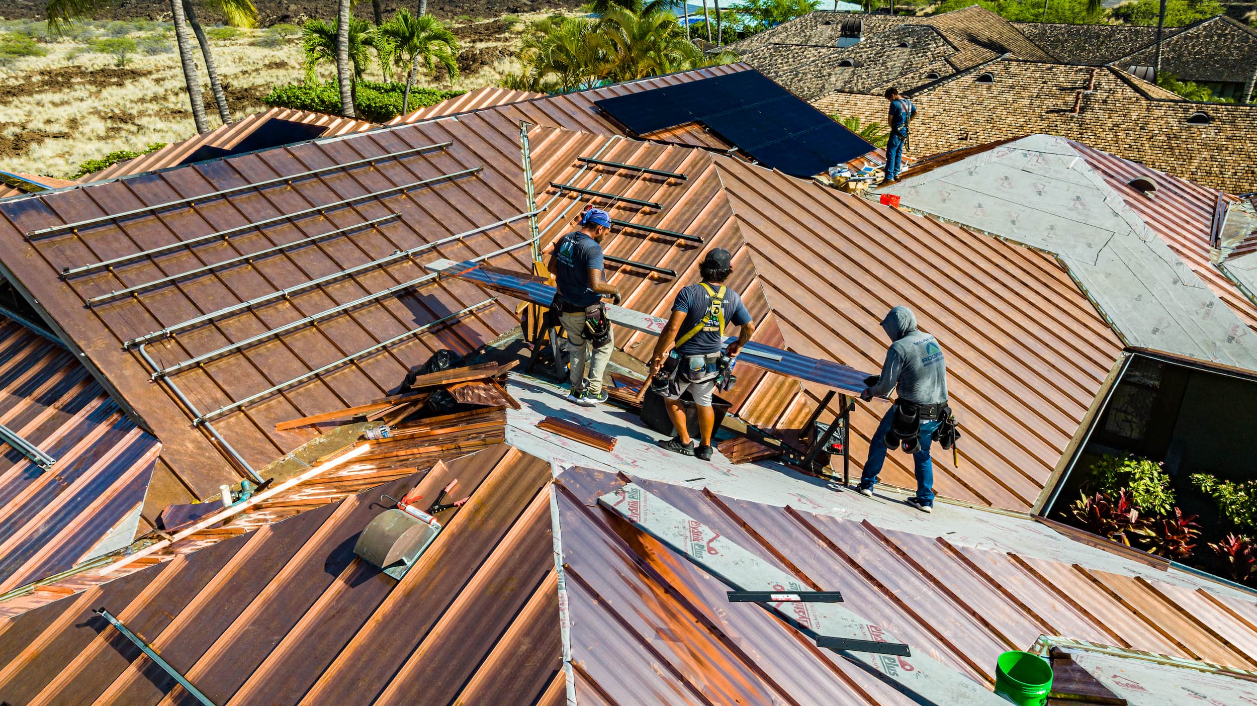 Technicians working on solar rooftop penetrations.