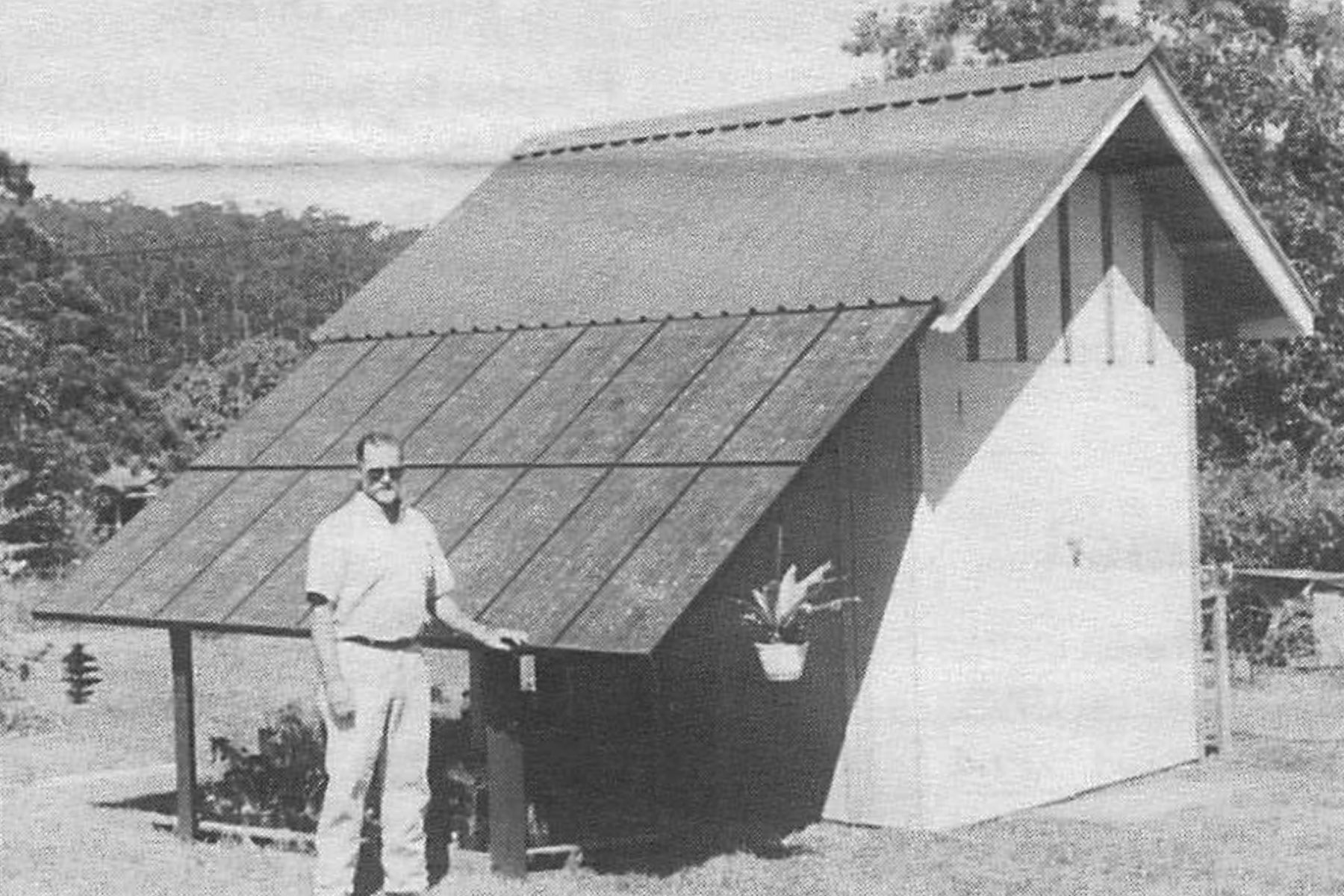 Peter Shackelford in front of an early solar installation, 1992