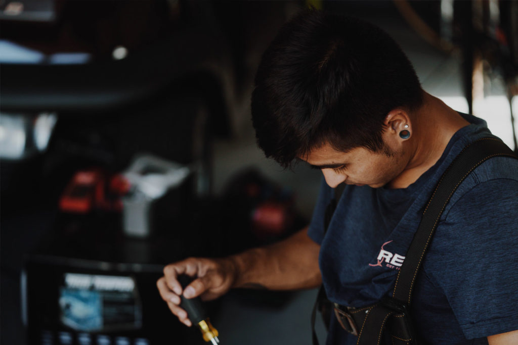 An electrician in a work van.